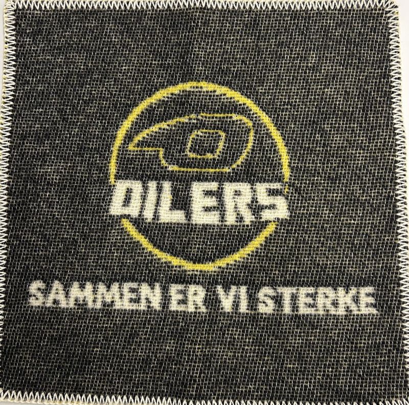 Sitteunderlag i tovet ull-Oilerslogo